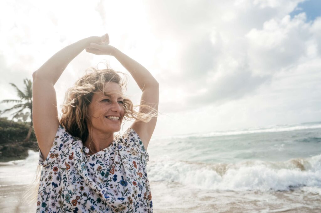 A lady practicing gratitude, watching the sea