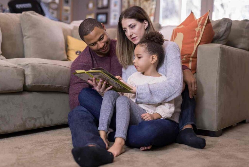 Parents reading some Great Read Aloud Picture Books to their daughter