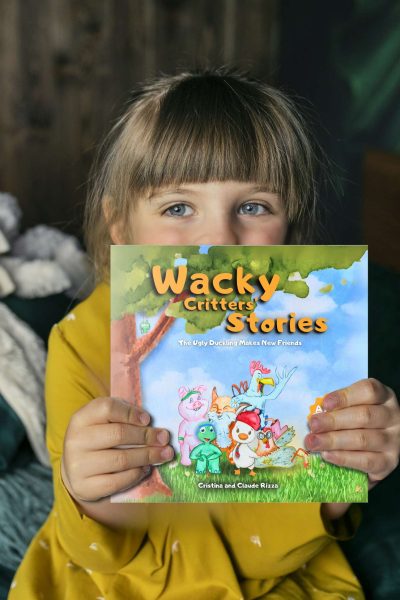 A young reader keep the Wacky Critters Stories Book in her hands, one of our inspiring books for kids and adults